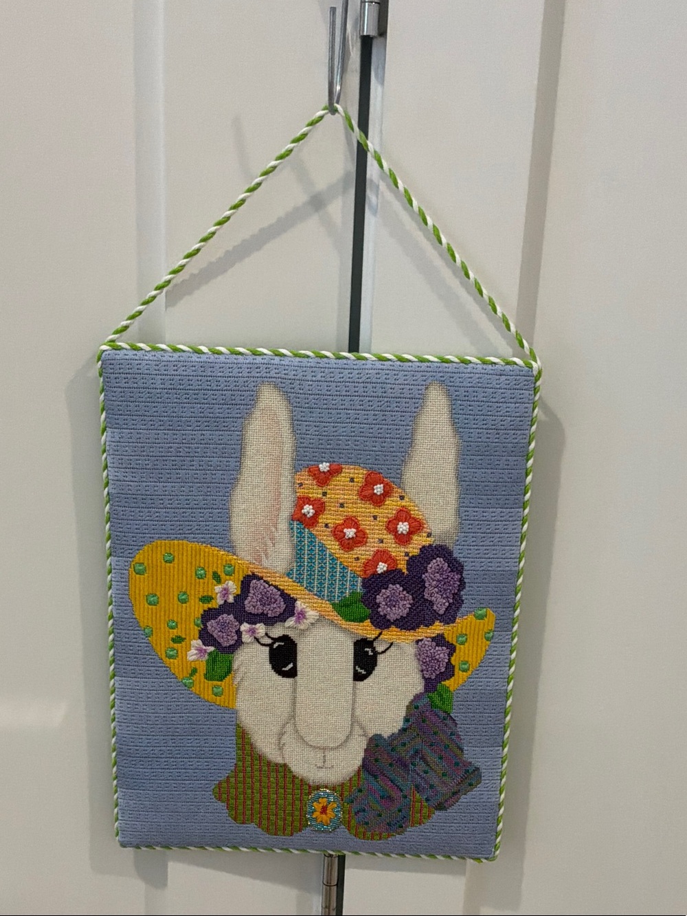 Handmade rabbit Wall Hanging with Floral Hat - Pastel Blue Background